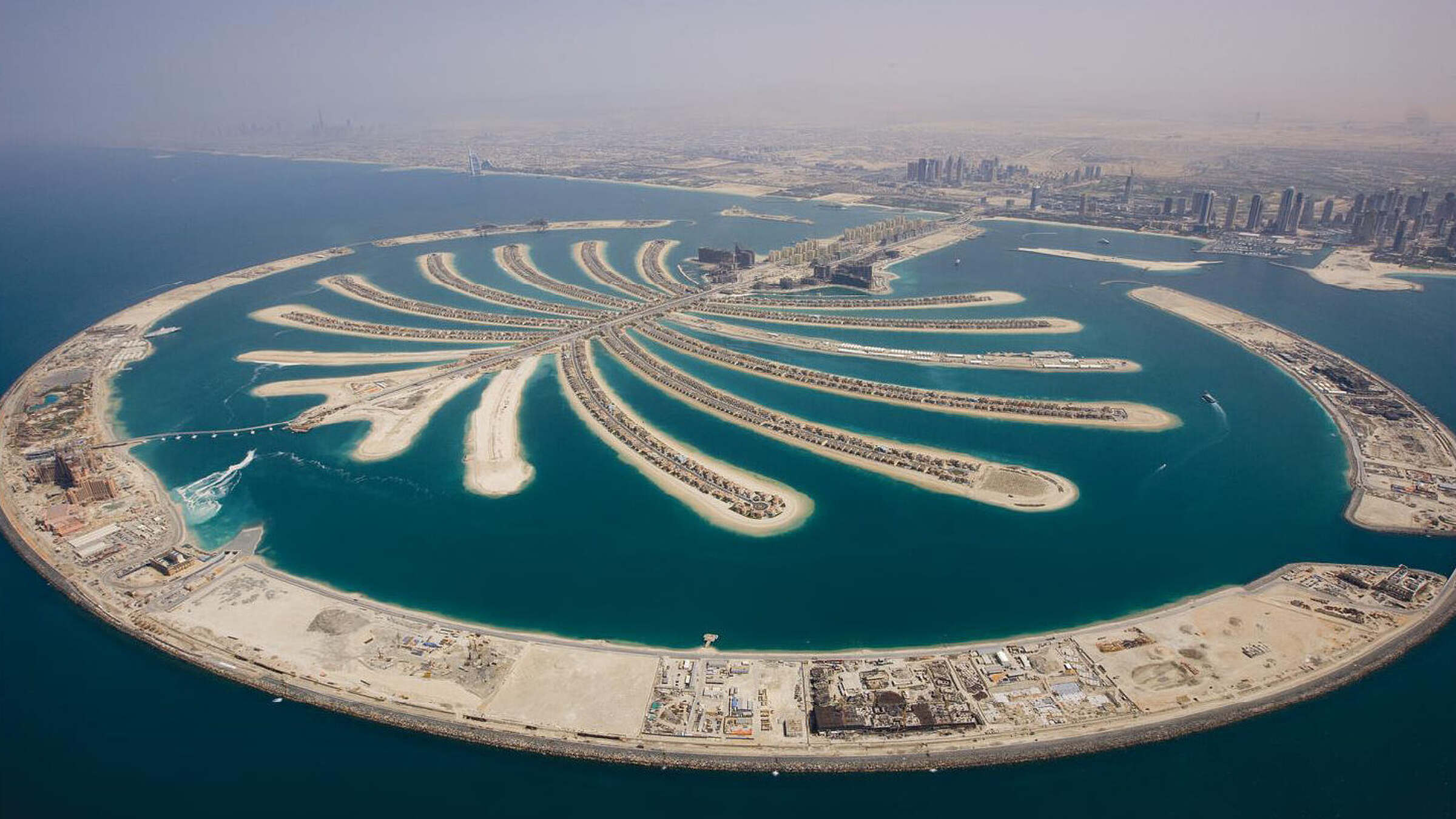 Aerial view of the full Palm Jumeirah showing its trunk, fronds and crescent